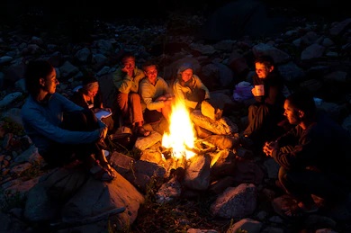 group-backpackers-relaxing-near-campfire-260nw-59945146